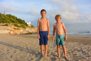 The boys on our favourite beach in Sitges. Our house is the white building in the background